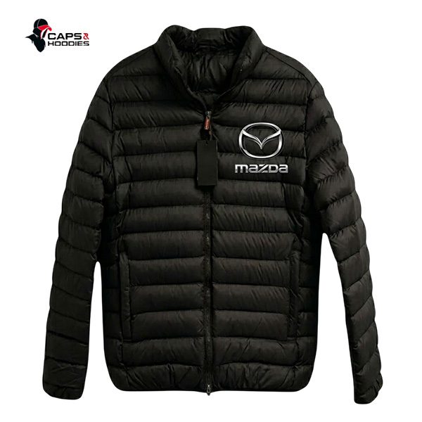 Mazda Branded Black Puffer Jacket Mazda Branded Black Puffer Jacket Branding: High-definition embroidered Mazda logo and wordmark on the left chest Material: Premium water-resistant nylon shell Insulation: Lightweight, high-loft synthetic down alternative for superior heat retention Closure: Full-length, heavy-duty YKK front zipper with custom pull Pockets: Two secure, zippered external hand-warmer pockets Fit: Athletic, modern tailored fit